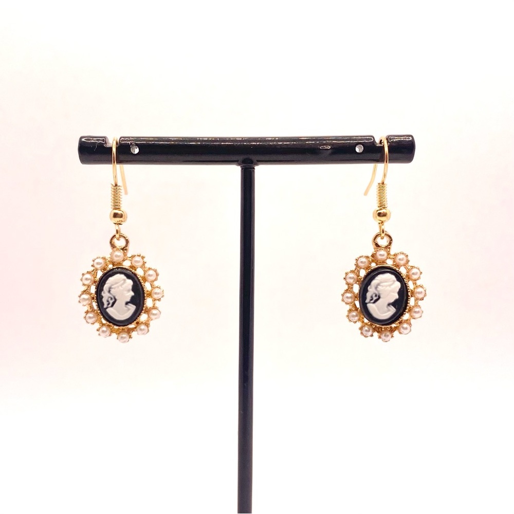 Black and white pearl rimmed cameo earrings